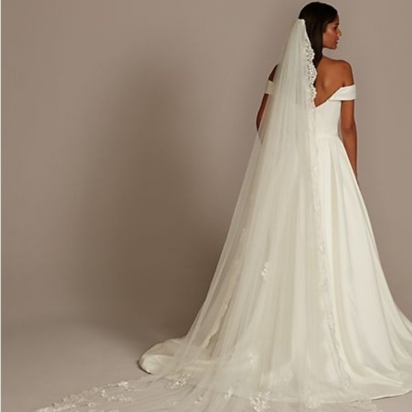 I am selling my strapless, ivory , ruffled mermaid wedding gown. - Picture 8 of 11